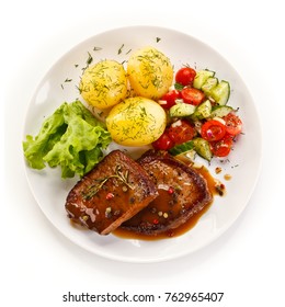 Grilled Steak With Vegetables On White Background 