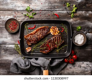 Grilled  Striploin Steak With Spices And Herbs On Grill Iron Pan.The Strip Steak, Also Called A New York Strip.