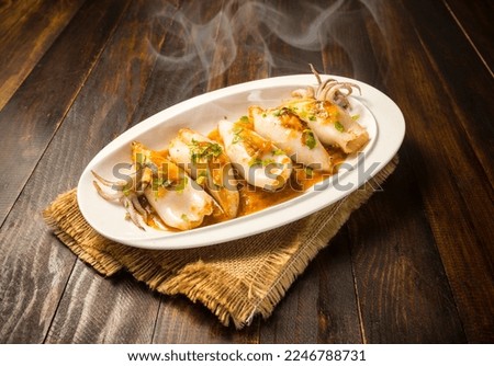 Grilled stuffed squid in sauce