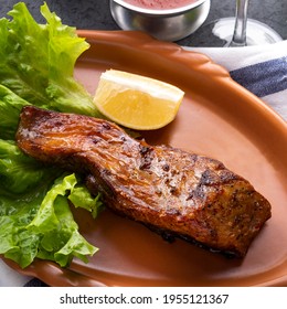 Grilled Sturgeon Fillet With Lemon Slice. Closeup