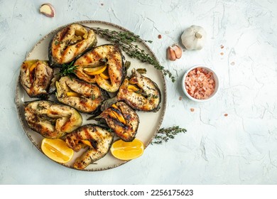 grilled sturgeon fish on a light background, Restaurant menu, dieting, cookbook recipe top view. - Powered by Shutterstock