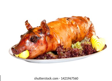 Grilled suckling pig on a plate - Shutterstock ID 1421967560