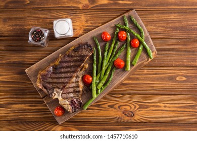 Grilled T-bone Steak With Asparagus And Cherry Tomatoes . T Bone Beef