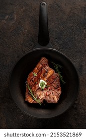 Grilled T-bone Steak With Seasonings, Rosemary And Butter In A Grill Pan. Cooking Porterhouse Beef Steak. Top View