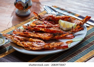 Grilled tiger prawns on the plate in a fish restaurant in Ngapali, Myanmar, Burma, close up