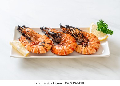 Grilled Tiger Prawns Or Shrimps With Lemon On Plate