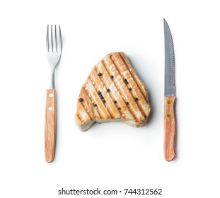 Grilled Tuna Steak And Fork With Knife Isolated On White Background.