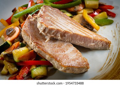 Grilled Tuna Steak With Vegetables On A Plate