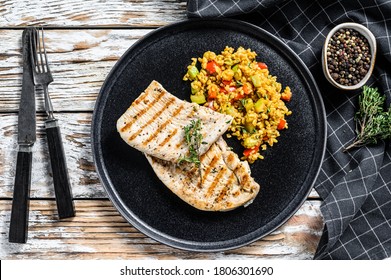 Grilled Turkey Breast Steaks With Quinoa Salad. White Background. Top View