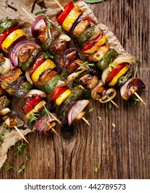 Grilled Vegetable And Meat Skewers On A Wooden Rustic Table, Top View