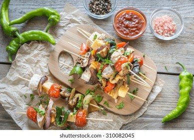 Grilled Vegetable Skewers On The Wooden Board