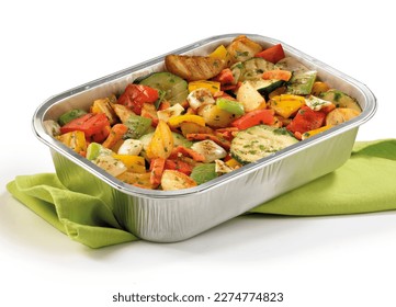 grilled vegetables in an aluminum tray with a green napkin underneath on a white background, bbq, colorful dish mixed vegetables, grilled vegetable salad