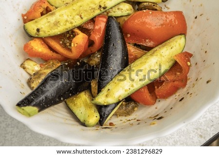 Grilled vegetables -bell peppers, zucchini, eggplant on a white plate, top view, close-up.