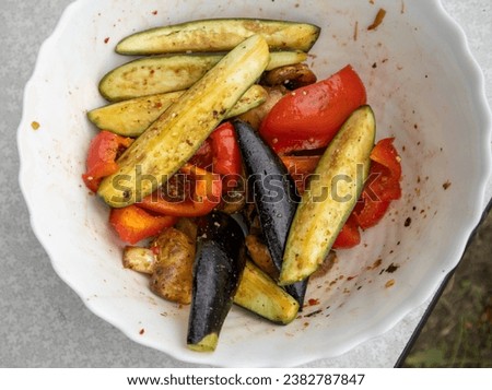 Grilled vegetables -bell peppers, zucchini, eggplant on a white plate, top view, close-up