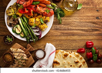 Grilled Vegetables And Chicken On Wooden Table Overhead Shot