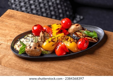 Grilled vegetables, colorful bell pepper, zucchini, eggplant, cherry tomatoes. Delicious. Dish serving in a restaurant, menu food concept.