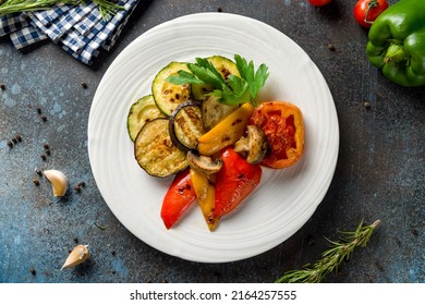 Grilled Vegetables On A Plate Top View On Blue Table