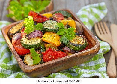Grilled vegetables  salad with zucchini, eggplant, onions, peppers and tomato - Shutterstock ID 247666594