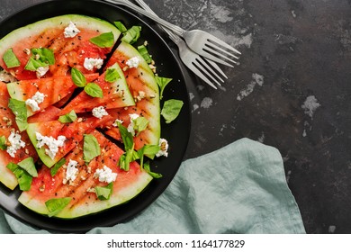 Grilled Watermelon With Cheese, Basil And Nuts On A Concrete Dark Background. Top View, Overhead, Flat Lay