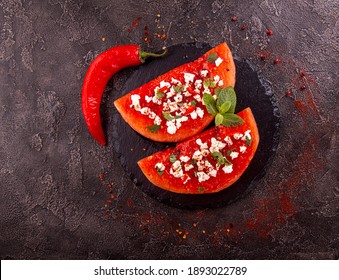 Grilled Watermelon With Feta Cheese, Chili Pepper And Mint. BBQ Healthy Food Concept.  Black Background. Top View. Overhead. Copy Space