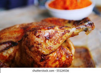 Grilled Whole Chicken In Glass Bowl On Wood