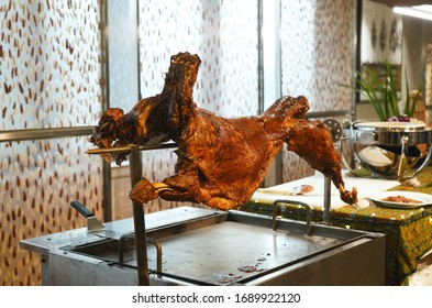 Grilled Whole Lamb Till Golden Brown At A Buffet Spread