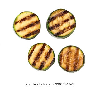 Grilled zucchini slices isolated on white background, top view.
Healthy summer veggie food. Fried zucchini slices.