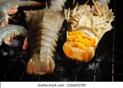 Grilling Flathead Lobster With Egg On The Sieve 