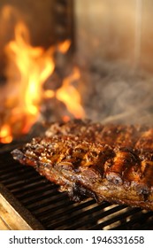 Grilling Grate With Tasty Pork Ribs In Oven, Closeup