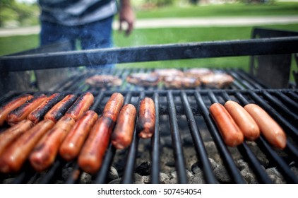 Grilling Hot Dogs And Burgers On Open Grill Outdoor Cooking In Park