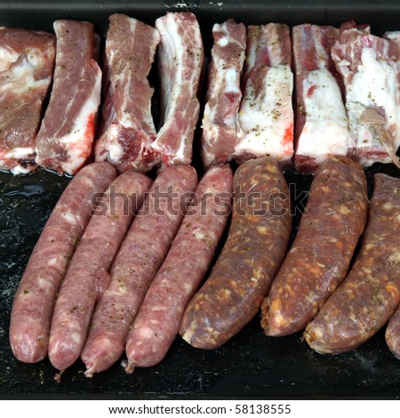 Grilling meat on a barbecue or barbeque bbq