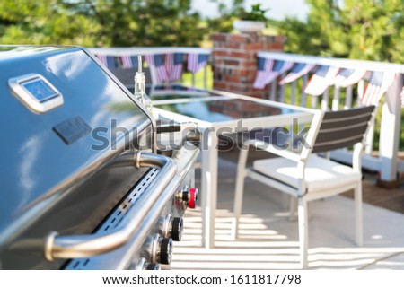 Grilling outdoor on a gas burning grill on the backyard patio.