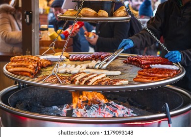 Grilling Sausages On Barbecue Grill At A Food Stall Of Christmas Market Winter Wonderland In London