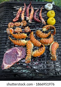 Grilling seafood on outdoor grill - Shutterstock ID 1866951976