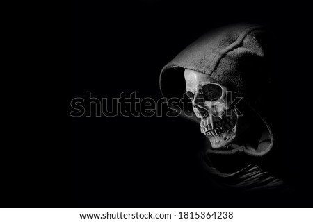 The Grim reaper in the dark with light , halloween background , scary devil evil or ghost