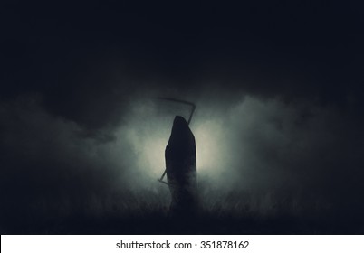 Grim reaper, the death itself, scary horror shot of Grim Reaper in fog holding scythe. - Shutterstock ID 351878162