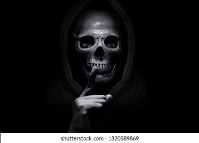 Grim reaper on dark background - Shutterstock ID 1820589869