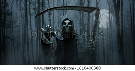 Grim reaper reaching towards the camera over dark forest background