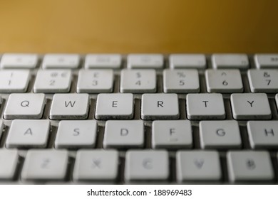 Grimy computer keyboard, focusing on QWERTY keys.