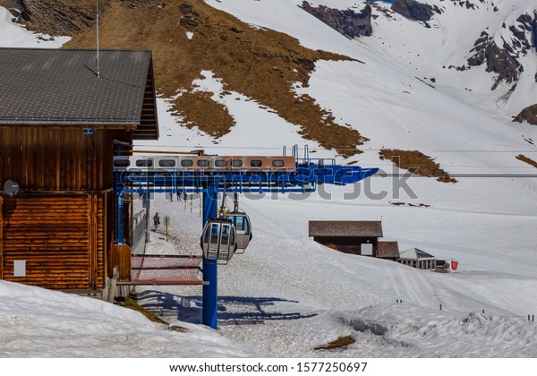 GRINDELWALD BERNE, SWITZERLAND- APRIL\
24: Gondola lift station at First peak Jungfau, APRIL 24,2018,\
Berne, Switzerland. Gondola lift station at First peak\
Jungfau