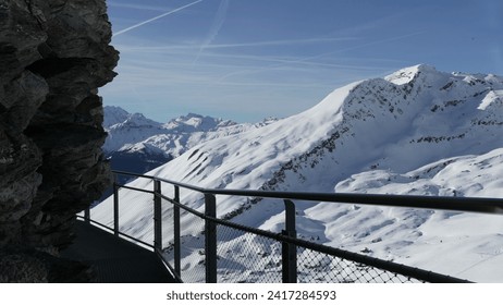 Grindelwald First Mountain Trail - Elevated Metal Pathway Along Cliffside with spectacular scenic mountain view landscape covered with snow - Powered by Shutterstock