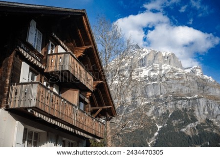 GRINDELWALD, SWITZERLAND - Apr 13, 2022 : View of Grindelwald train station and surrounded Alps. Switzerland