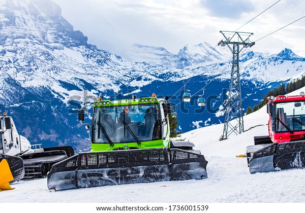 Grindelwald/Switzerland-December 2019: Plow\
snow removal equipment in the First mountains in Grindelwald,\
Bernese Alps,\
Switzerland.