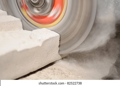 Grinder Cutting Concrete Block