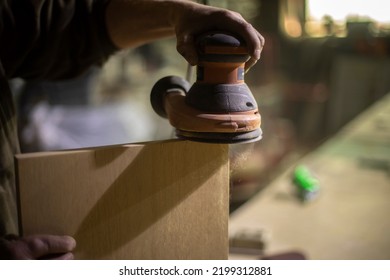 Grinding Board. Wood Processing. Electro Tool In Hand.