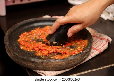 Grinding Chili With Stone Or Manual Process Of Making Chili Sauce