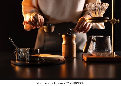 Grinding coffee beans, barista making handcrafted artisan coffee - stock photo