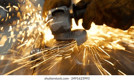 Grinding a metal door in production. Grinding a steel structure with an electric wheel at a factory. Door industry factory. Sparks from the grinding wheel. - Powered by Shutterstock