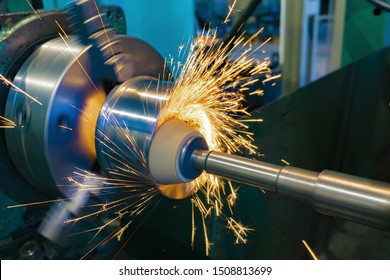 Grinding operations with an end abrasive wheel on a circular grinding machine with sparks. - Shutterstock ID 1508813699