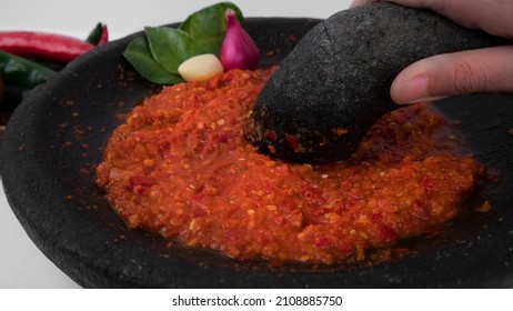 Grinding Red Hot Chili Paste With Mortar And Pestle Close Up